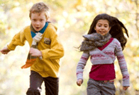 A boy and girl running