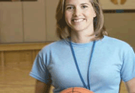 Woman coach holding basketball